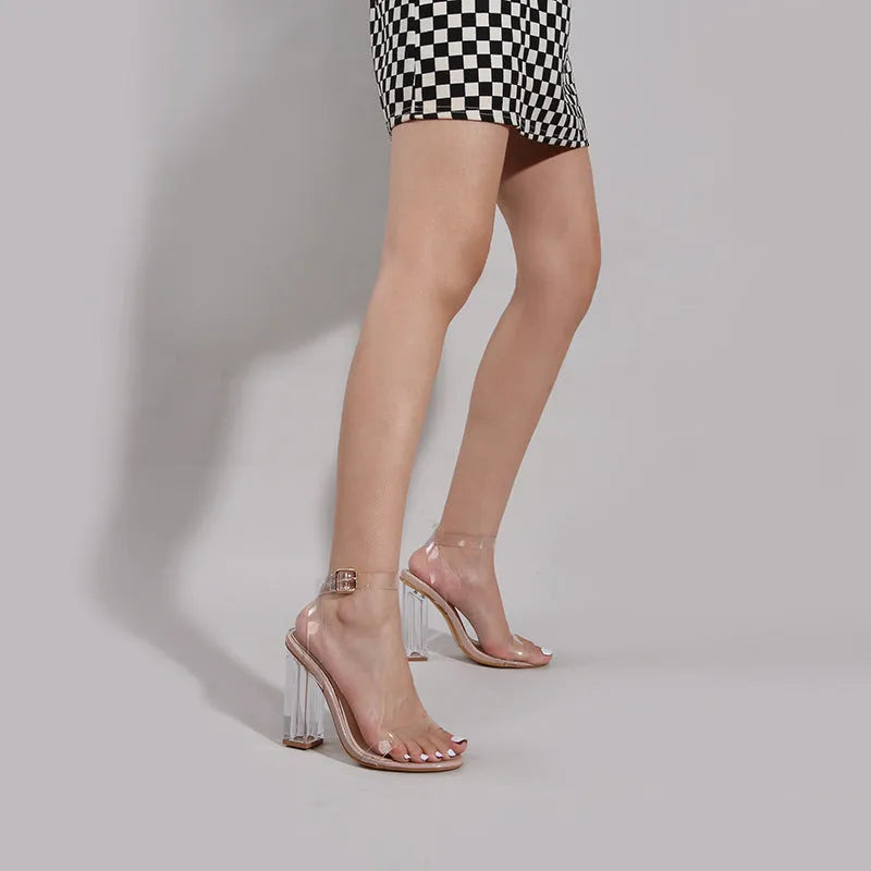 Apricot women's high heel sandals with a clear glass heel and buckle fastening.