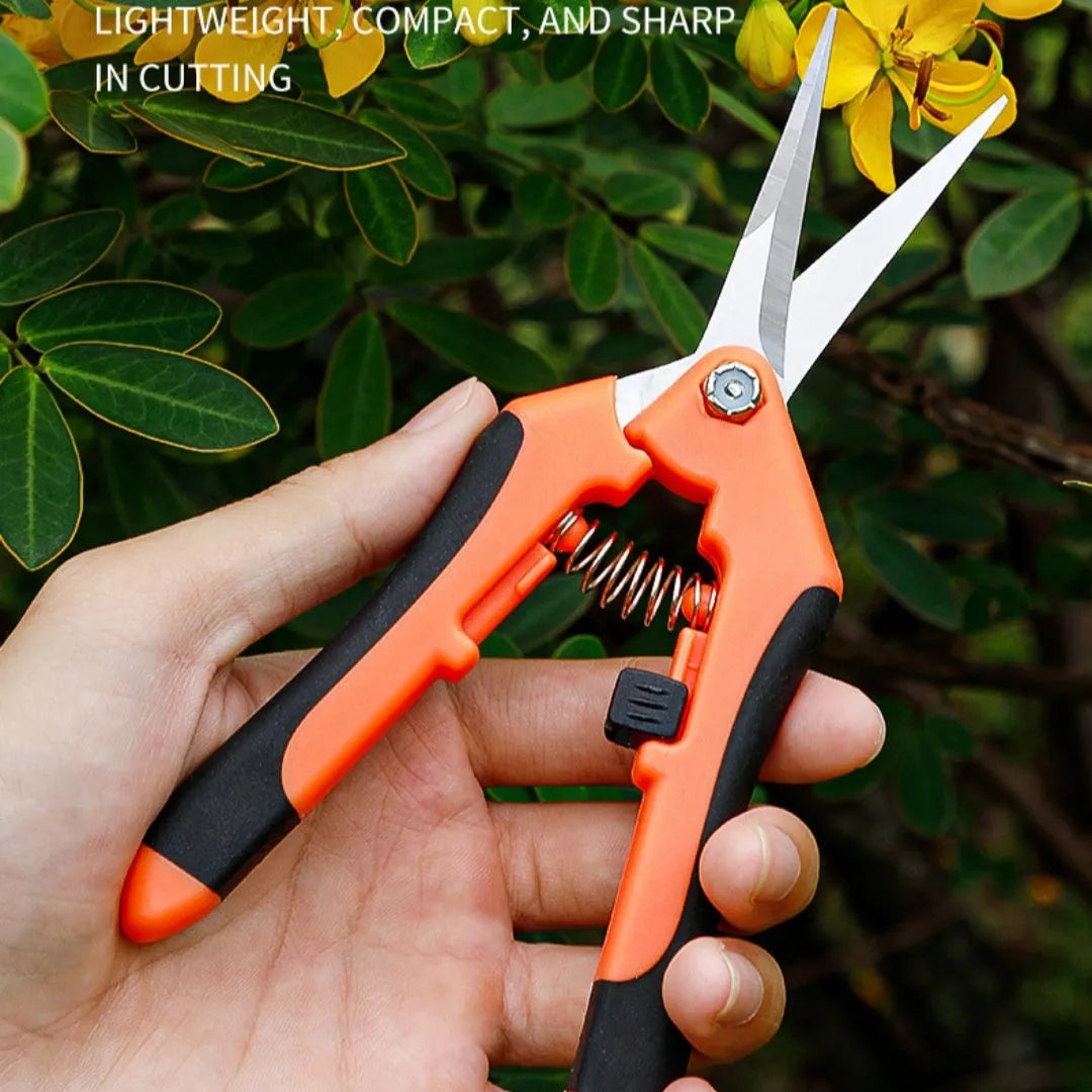 Set of three stainless steel pruning shears in yellow and orange with straight heads on white background