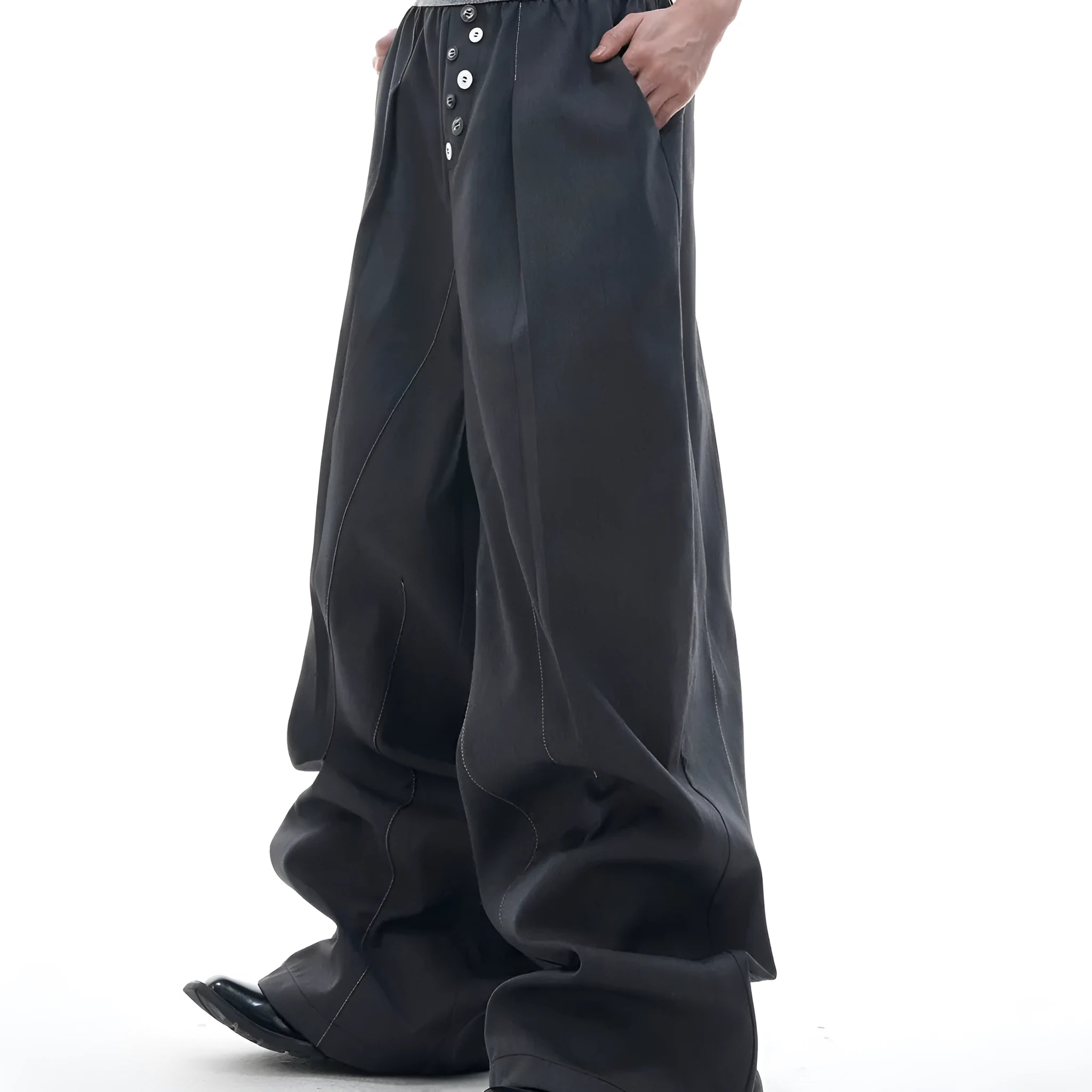 A pair of high-waisted straight-leg casual trousers in grey with a button fly front.