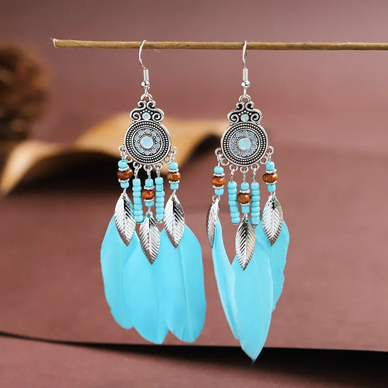 Feather-shaped drop earrings with leaf pattern in thirteen colour options on alloy metal