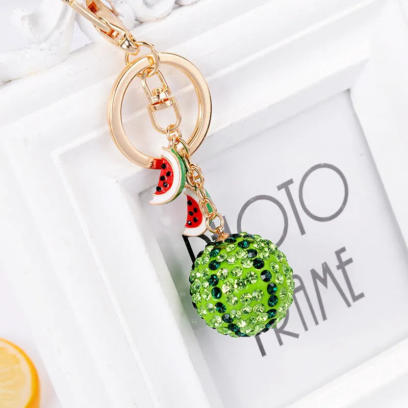 Green zinc alloy watermelon-shaped keychain measuring 12cm.