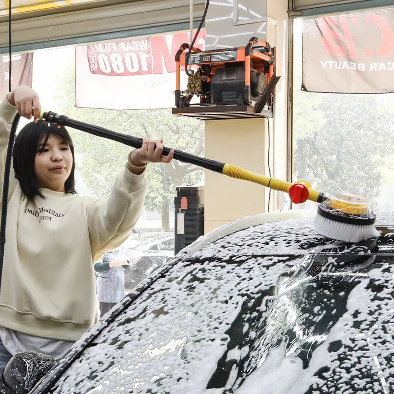 Bright yellow car wash mop cleaning tool with a long hose and a brush head featuring chenille and outer plastic bristles.