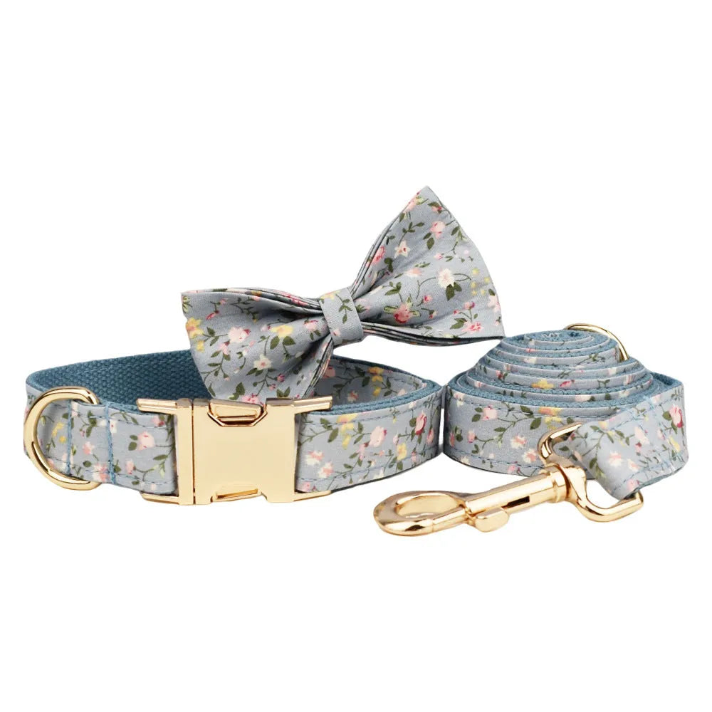 Blue floral pattern dog collar set with matching leash, vest, bow and accessories for small dogs