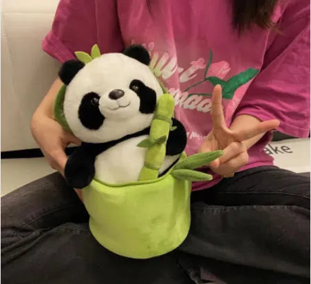 Panda plush doll holding bamboo shoots in bamboo tube design with PP cotton filling