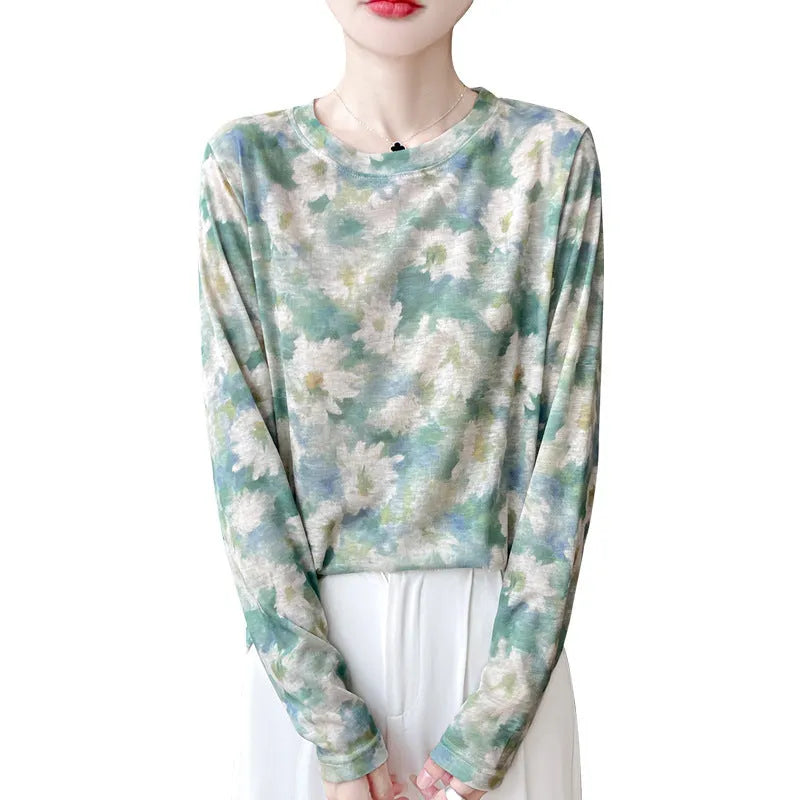 Round neck Tencel cotton pullover shirt with a colourful floral print, shown on a hanger.