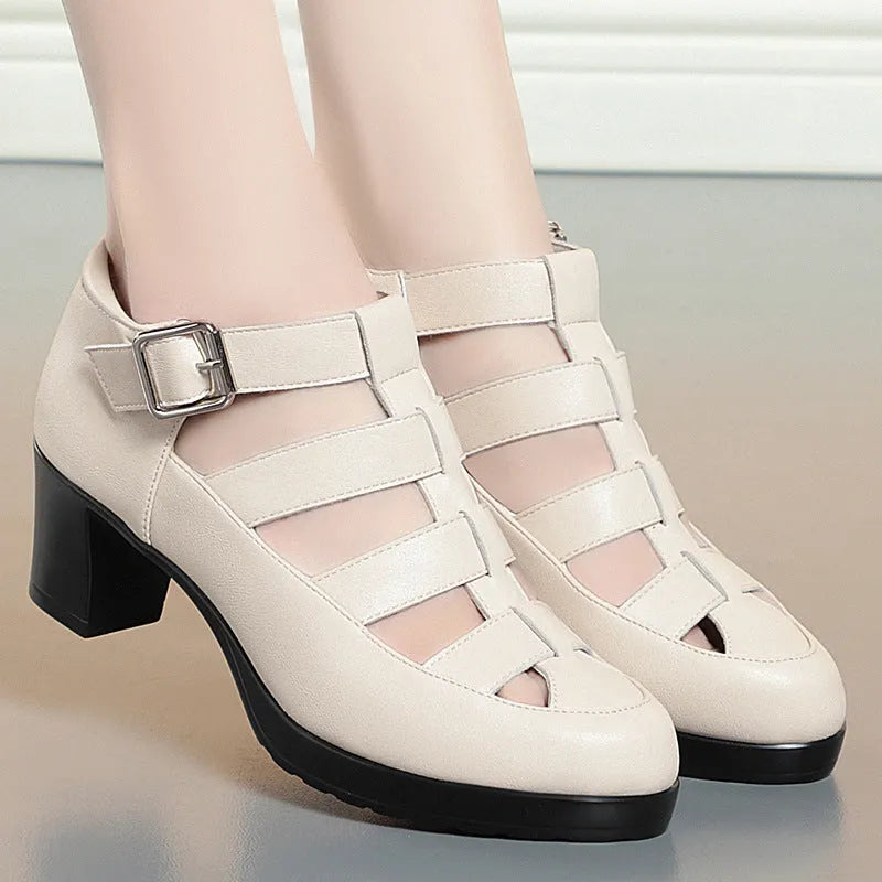 Beige women's closed toe sandals with a chunky heel, woven hollowed upper, and ankle strap buckle.
