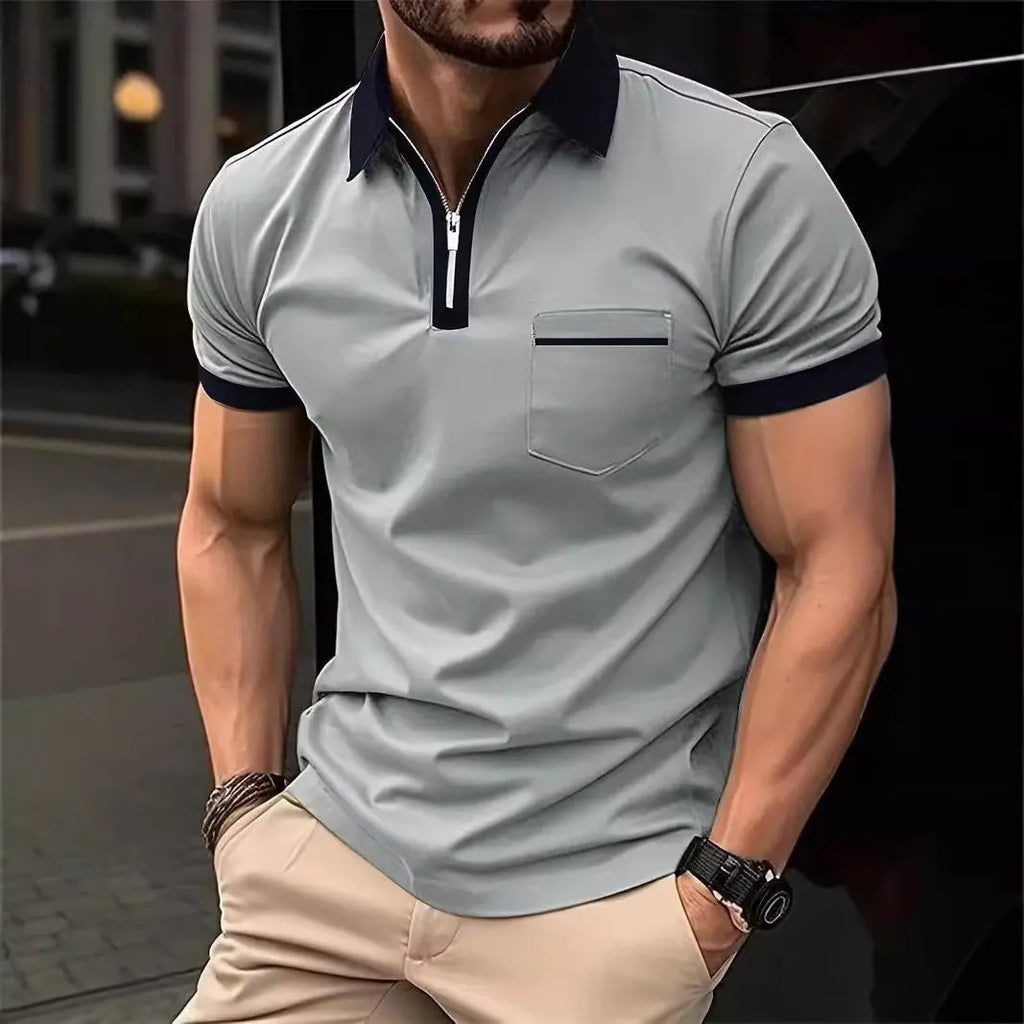Man wearing a loose-fit short-sleeve casual shirt with a chest pocket and a zipper decoration on the front.