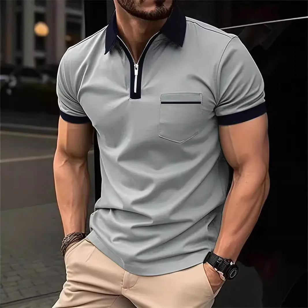 Man wearing a loose-fit short-sleeve casual shirt with a chest pocket and a zipper decoration on the front.