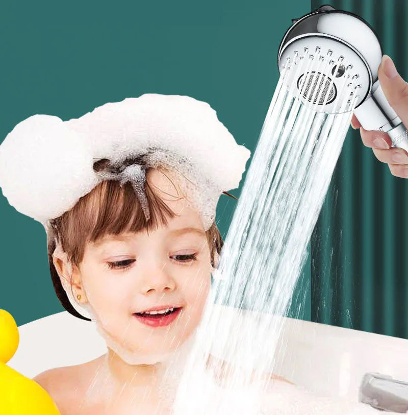 Silver coloured compact handheld shower head for gentle pet and baby baths.