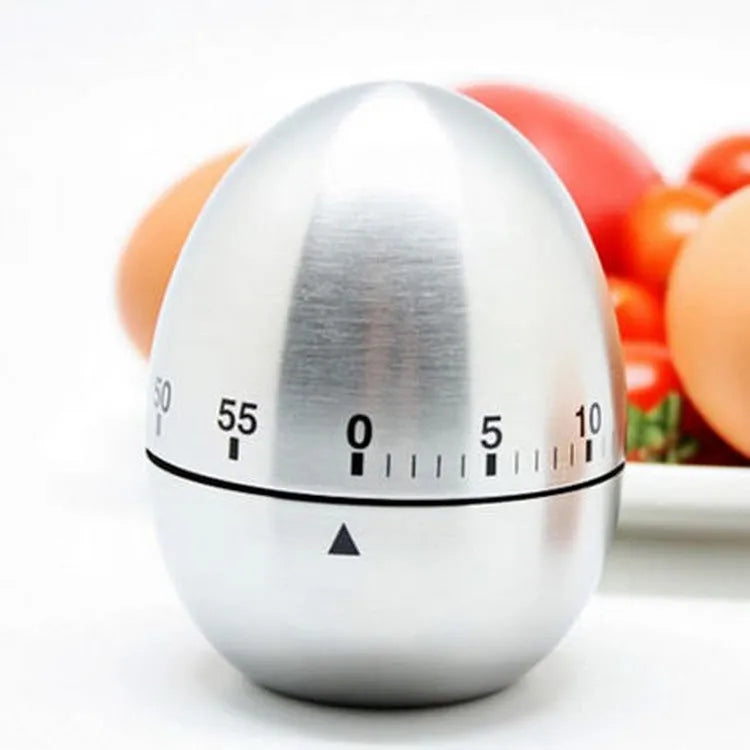 Stainless steel egg-shaped mechanical kitchen timer with manual dial.