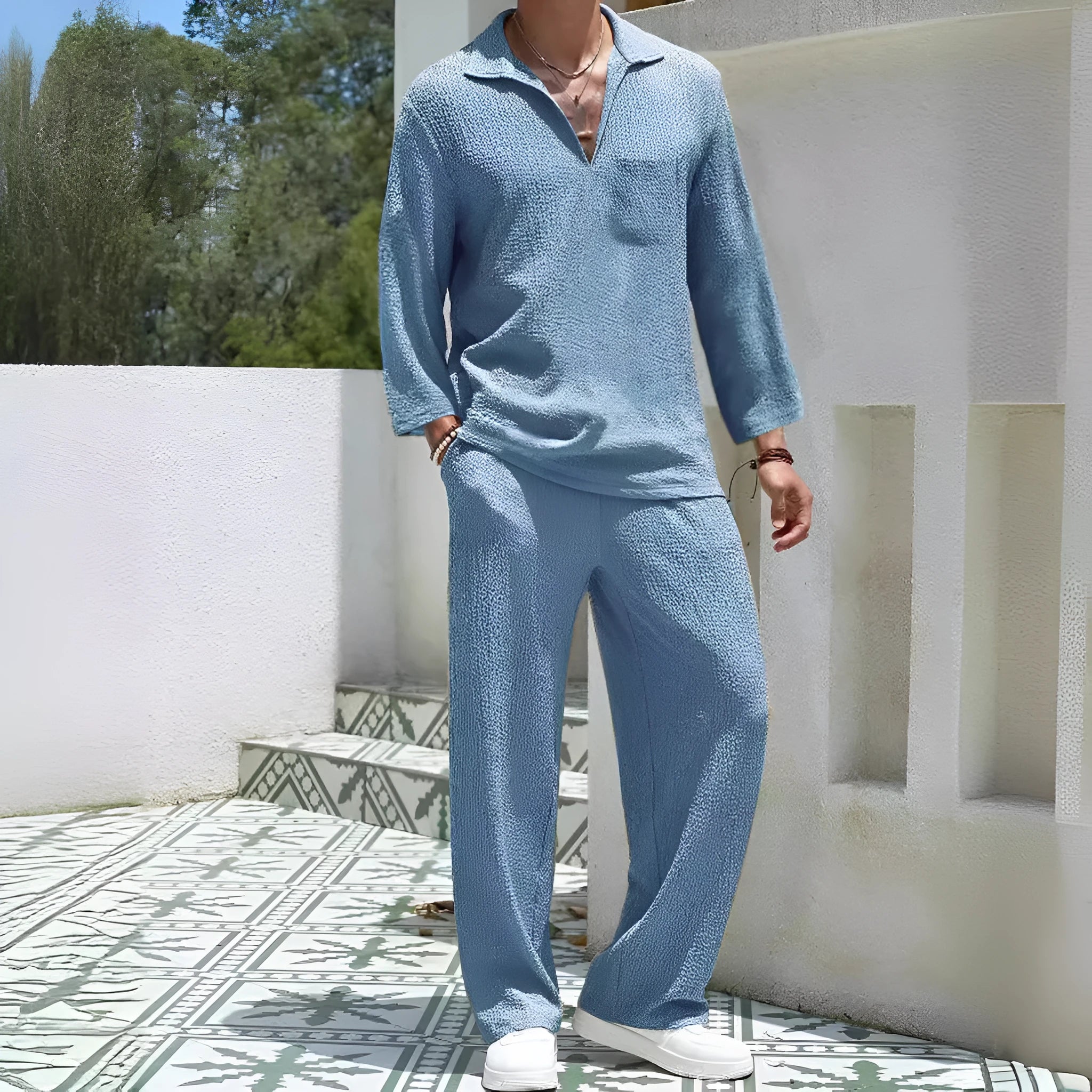 Men's casual polyester commuter suit in lake blue, showing shirt jacket and trousers laid flat.
