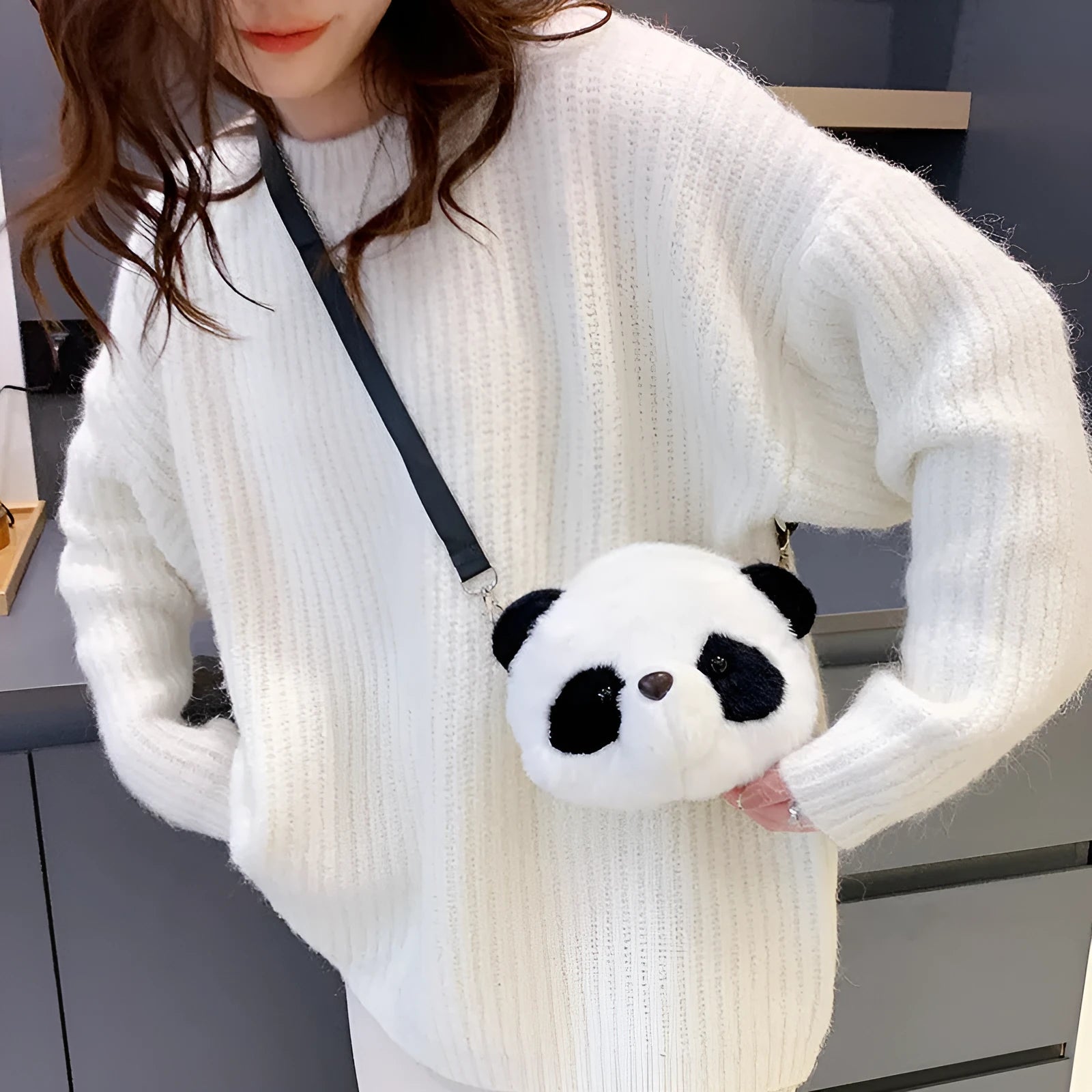 Soft plush panda head cylindrical crossbody bag with an outer sandwich pocket.