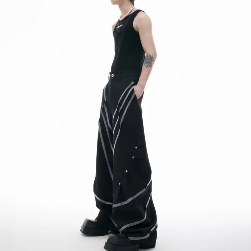 Men's black polyester trousers with metal striped rivet pleats and three-dimensional tailoring.