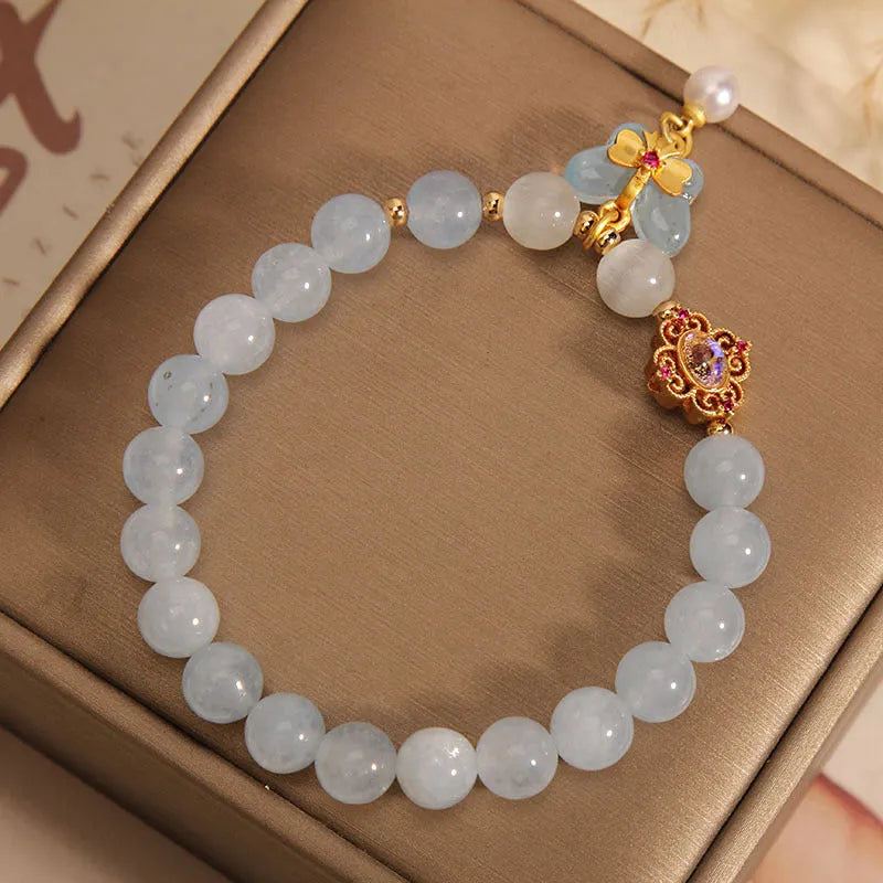 Women's aquamarine butterfly pendant bracelet with crystal and rhinestone details