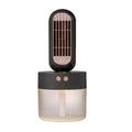 Small black and white portable humidifier fan with side-to-side head shaking feature and charging cable