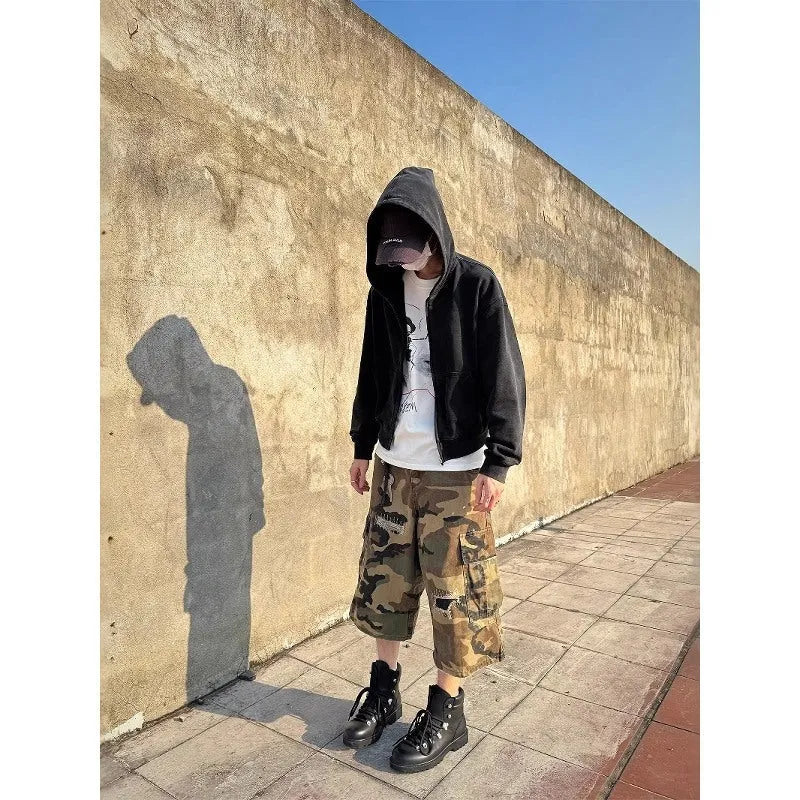 Men's loose-fit camouflage cropped jeans with ripped patches and straight leg