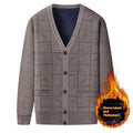 Dark grey men's batwing sleeve cardigan sweater with velvet lining, shown on a hanger.