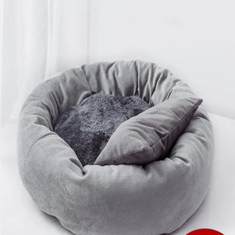 Circular light grey dog bed with PP cotton filling showing raised edges and optional pillow
