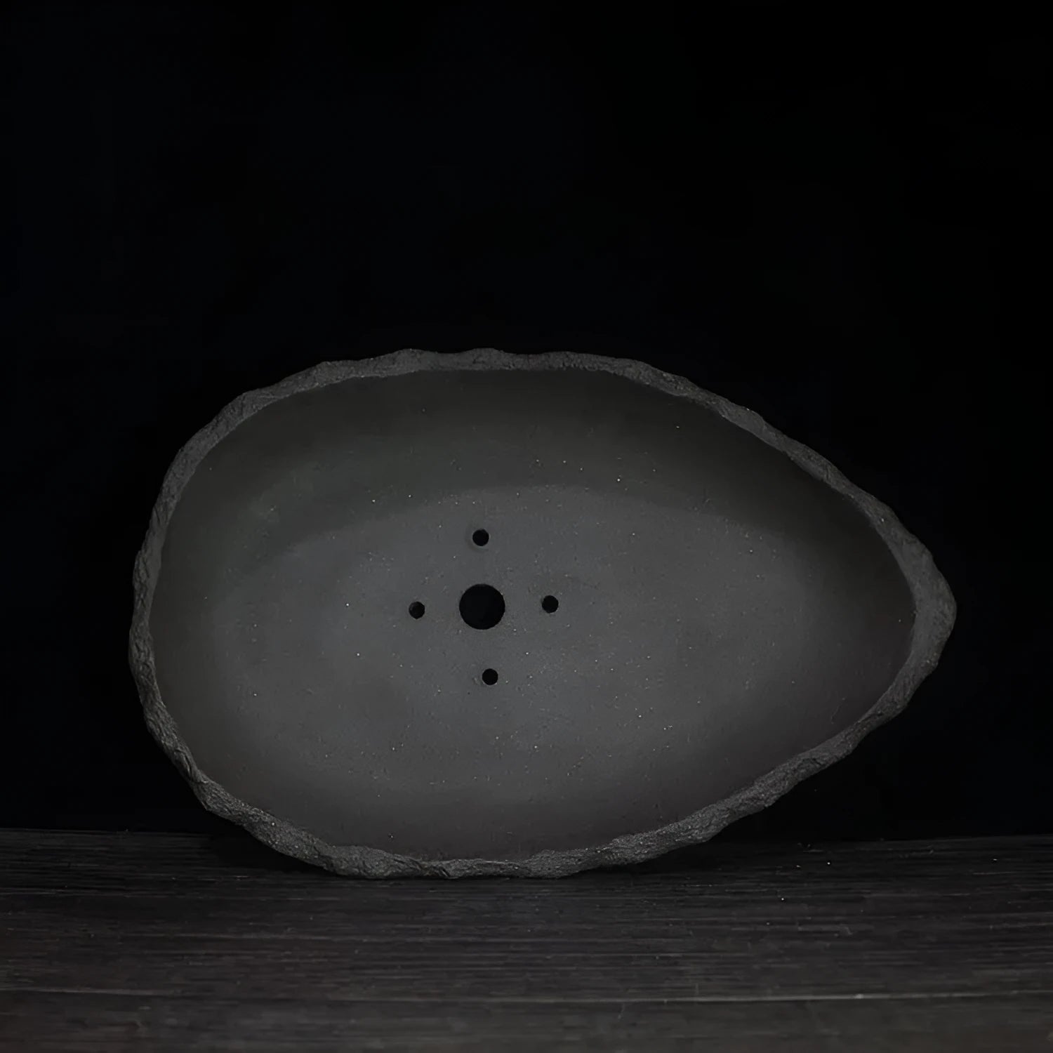 Handmade purple clay flower pot with unique shape showing three size options
