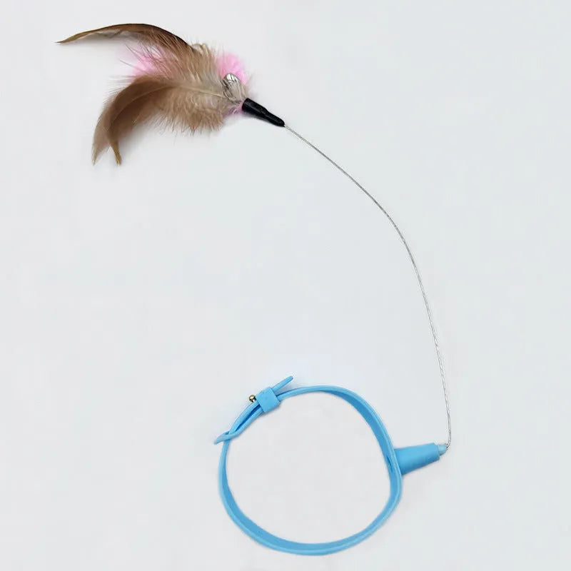 Adjustable cat toy collar with feather bell attachment in pink or blue colour for cats with 17-27cm neck circumference