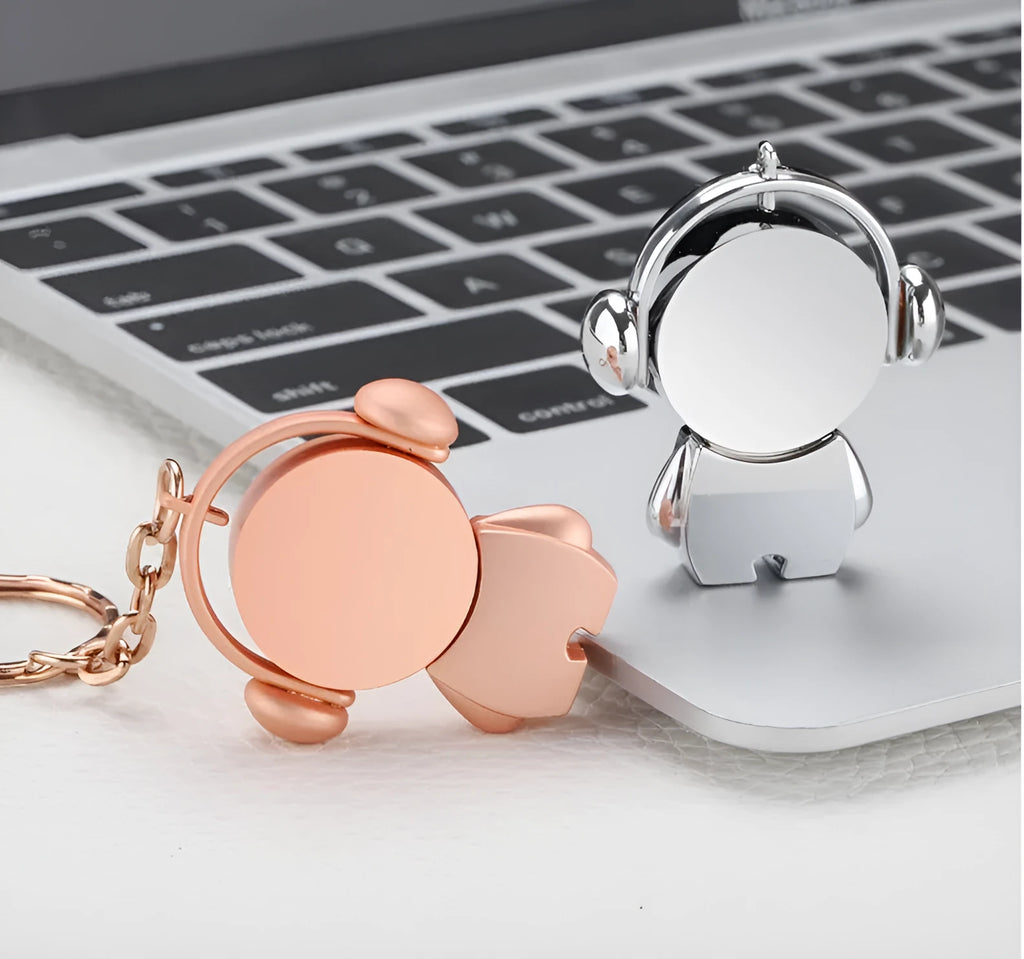 Silver metal USB flash drive with musician cartoon design showing compact dimensions