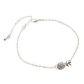 Women's alloy bracelet with pineapple fruit charm in gold or silver finish showing adjustable closure