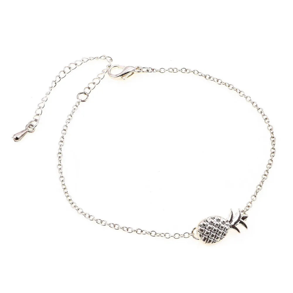 Women's alloy bracelet with pineapple fruit charm in gold or silver finish showing adjustable closure