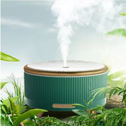 Cylinder plastic USB humidifier in black with 500ml tank and single fog outlet on a bedside table