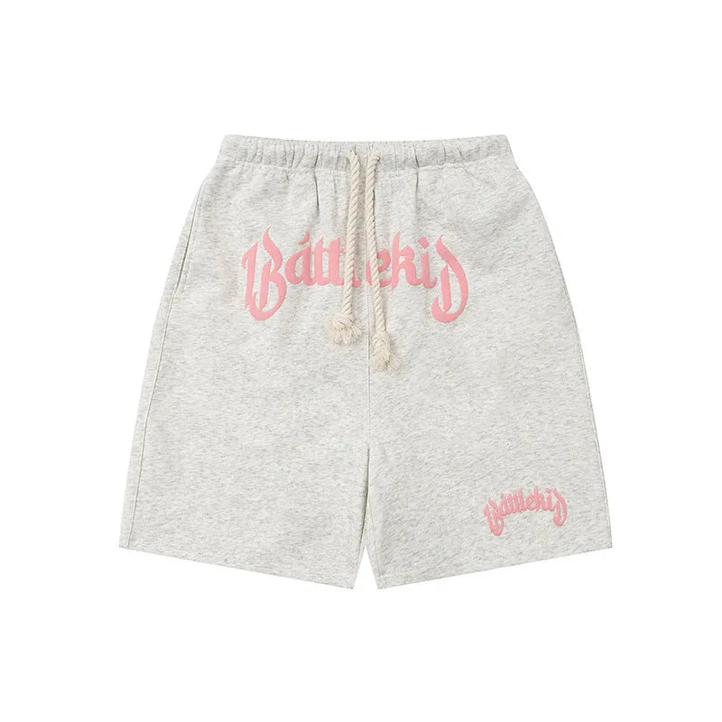 Man's loose-fit cotton-blend shorts in black, shown in a casual streetwear style.