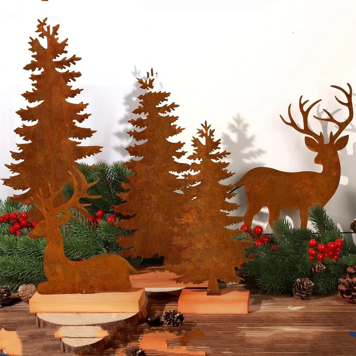 Three rustic iron metal Christmas tree decorations with elk silhouettes and weathered finish