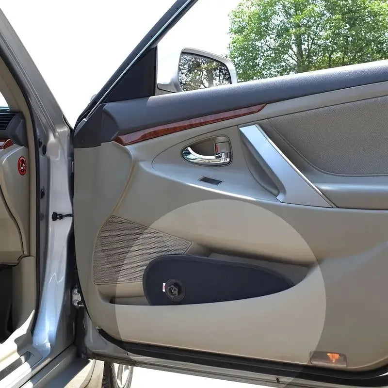 Black stretchy car side window shade with suction cups installed on a car window.