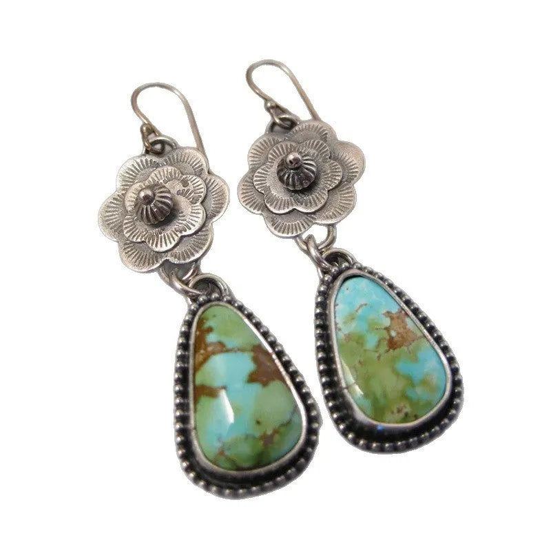 Silver metal carved floral tassel earrings in retro vintage botanical style for women