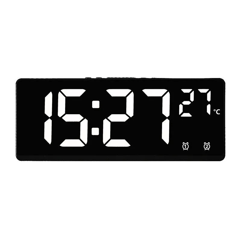 Electronic alarm clock with large LED screen showing time and temperature, in acrylic casing.
