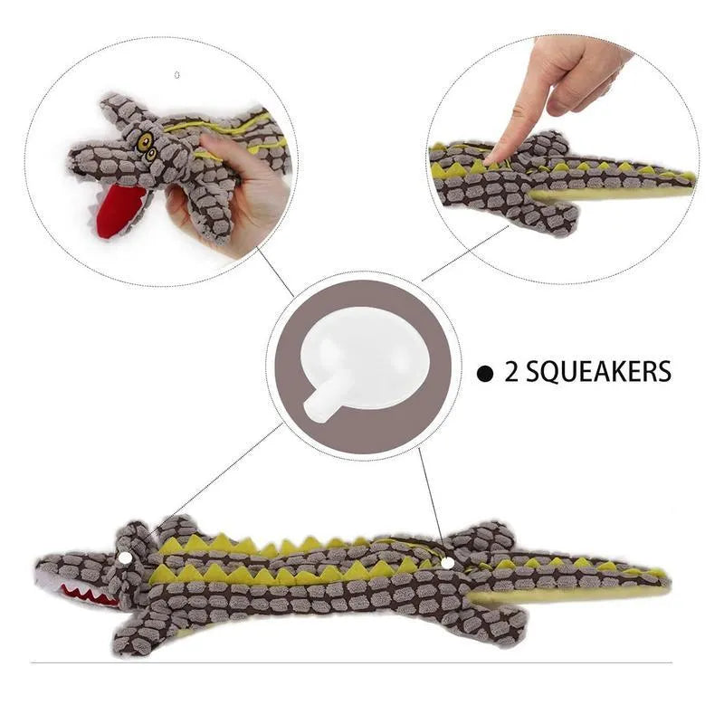 Blue plush crocodile-shaped dog toy with corduroy texture and squeaker, shown next to measuring tape