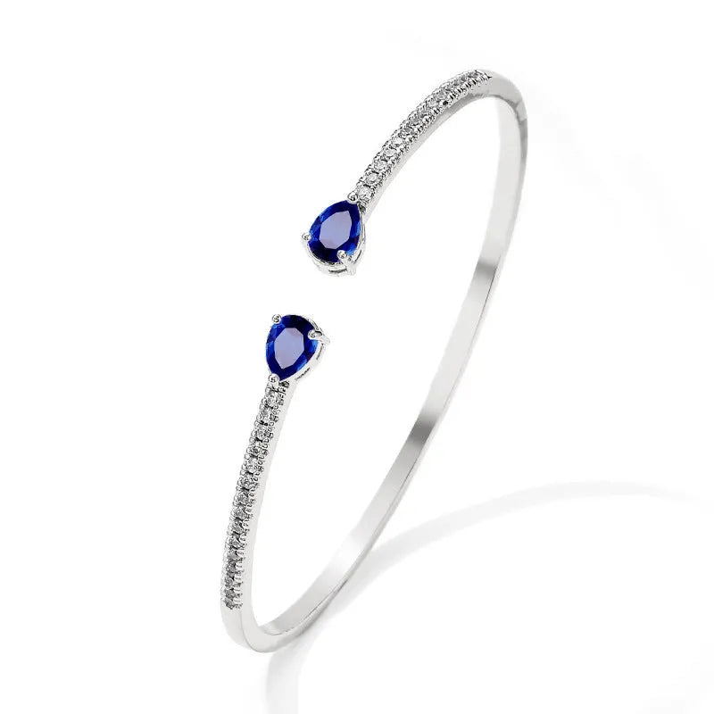Multi-zircon personalised fashion bracelet with inlaid treatment on copper in blue and white options