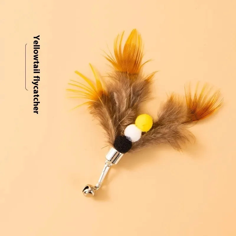 Three steel wire cat toys shaped like small flying insects on a plain background.
