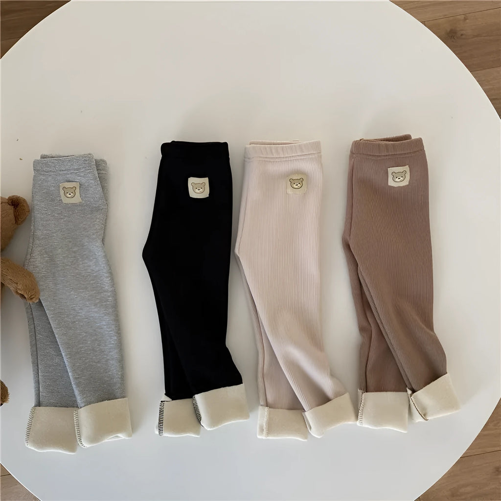 Girl's high-waist fleece-lined winter leggings in solid colour with wool lining and hair band belt.