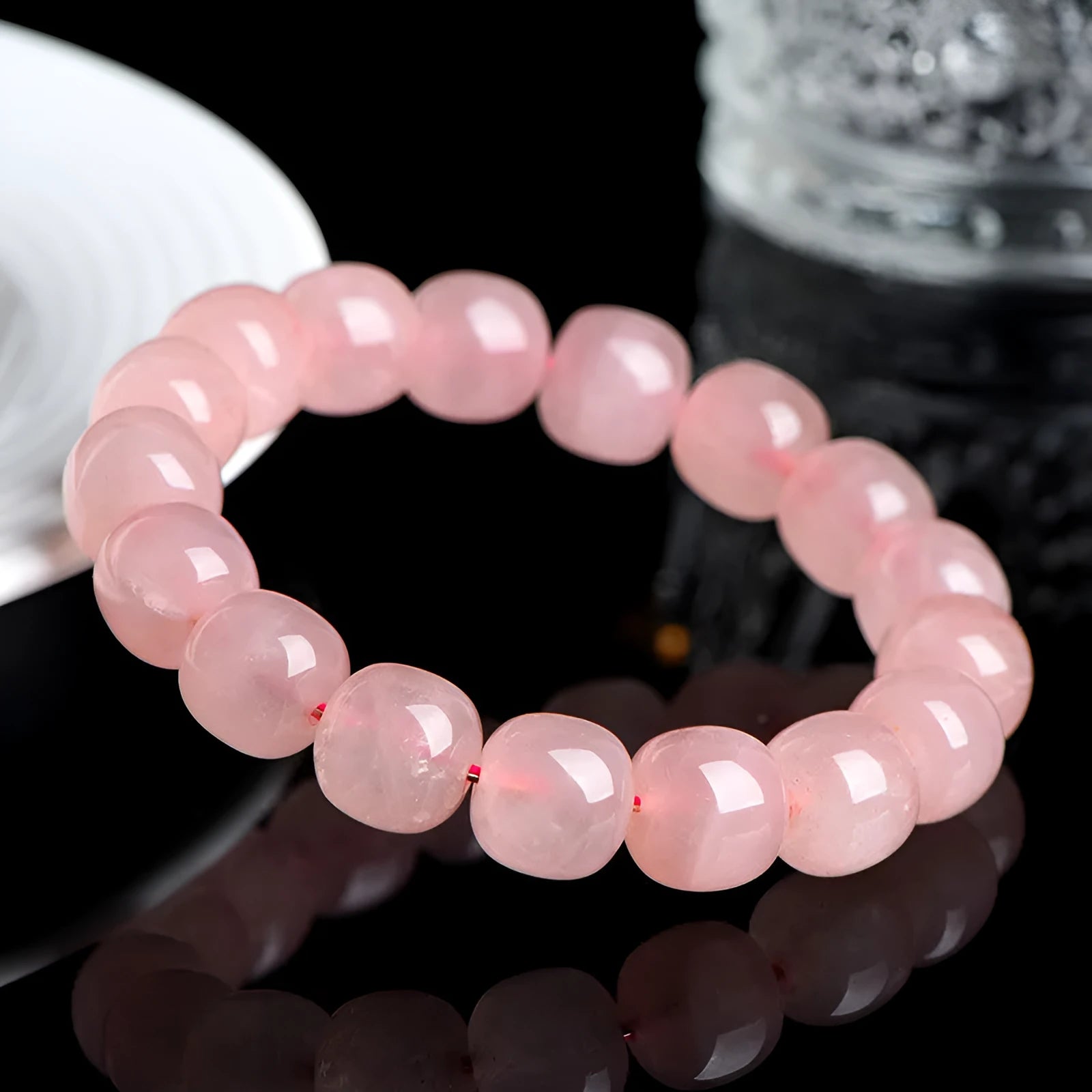Pink crystal barrel bead bracelet with 8-10mm polished geometric beads