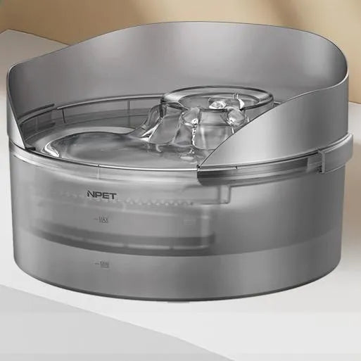 Automatic circulating water dispenser for cats and dogs with filter and pump on a kitchen floor.