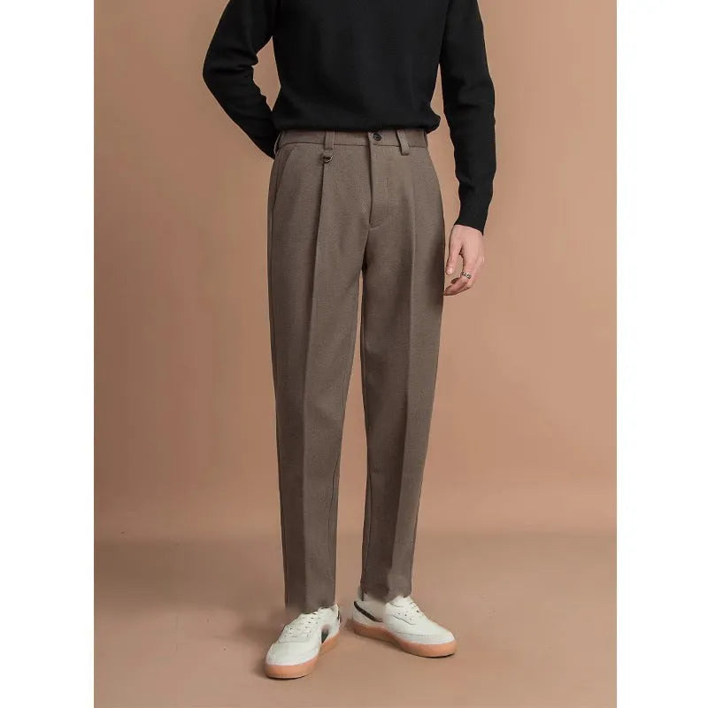 Man wearing straight leg grey suit pants for business casual attire.