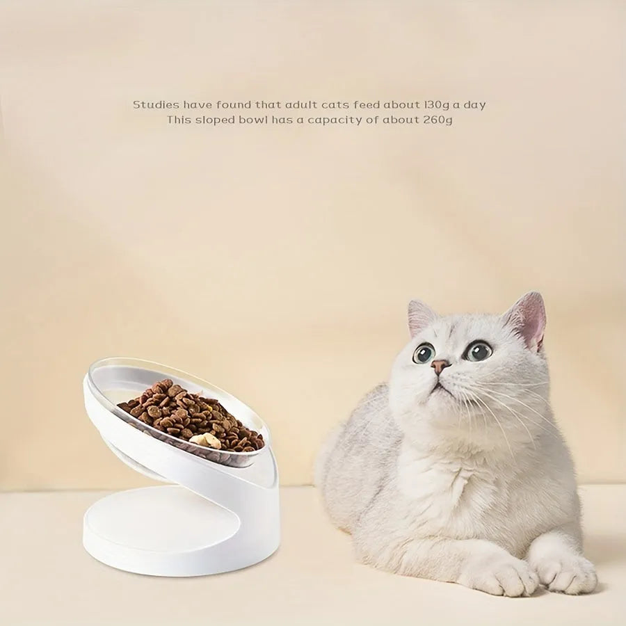 White elevated cat food bowl with a tilted surface on a raised platform.