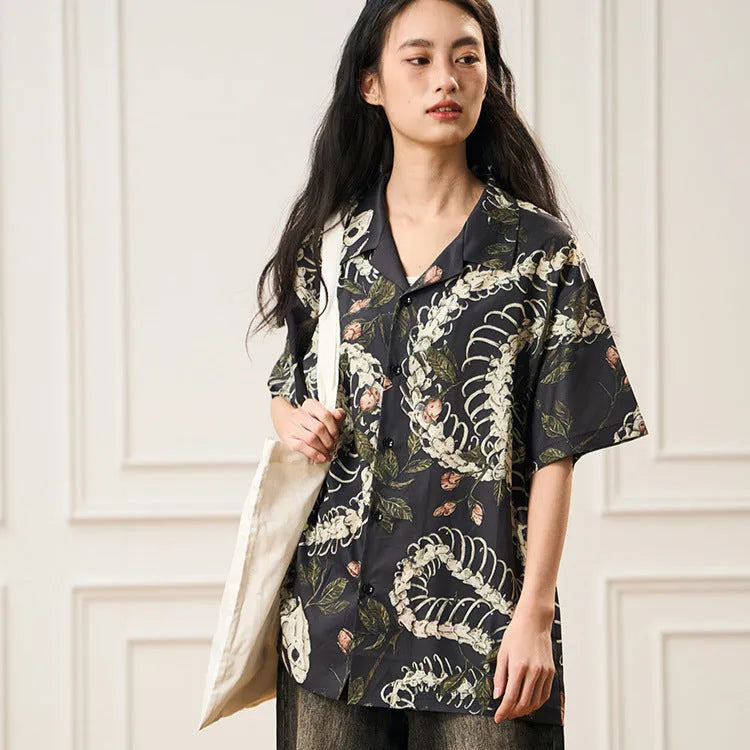 Short sleeve Cuban collar shirt with a snake bone and floral pattern in a loose fit.