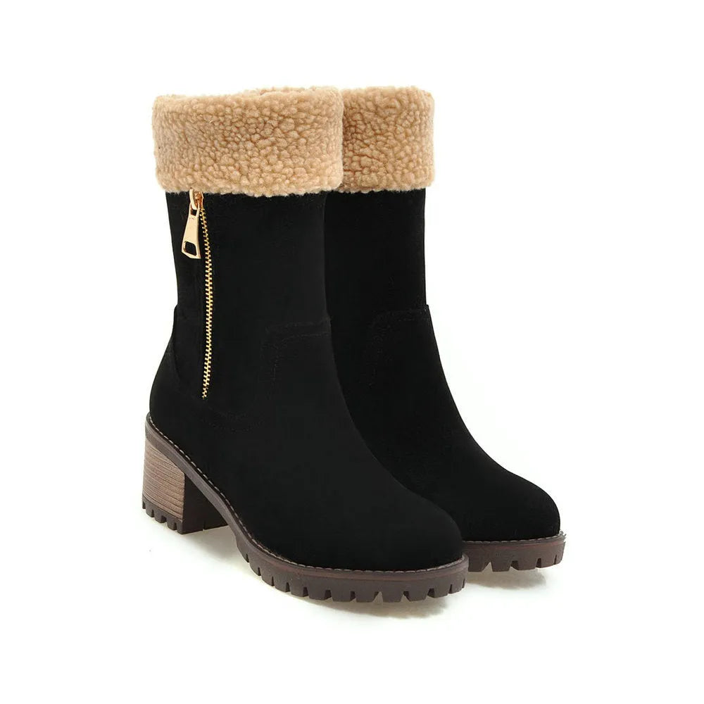 A pair of adult snow boots in black with a soft plush lining and rubber insole.
