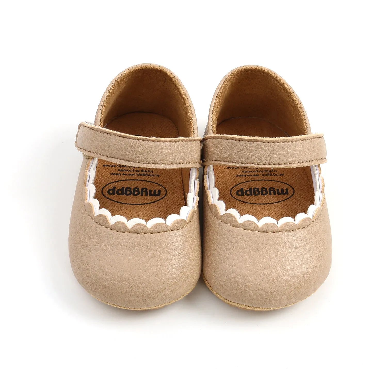 Baby girl's white velcro fastening shoes with low tube height, shown on a size chart.