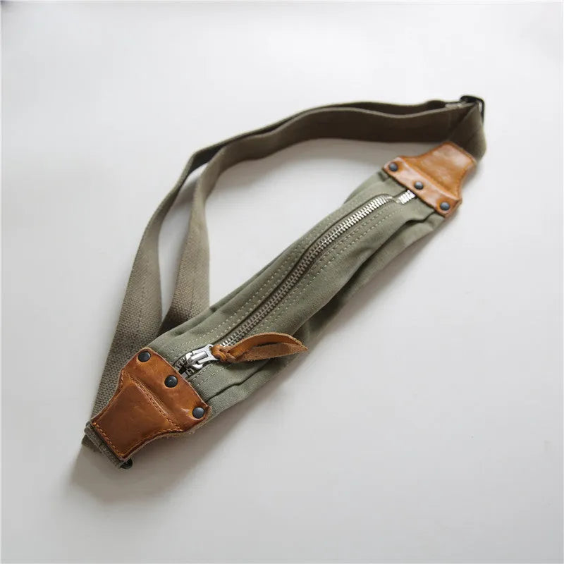 Green American retro military-style chest bag made of washed canvas with Italian leather accents