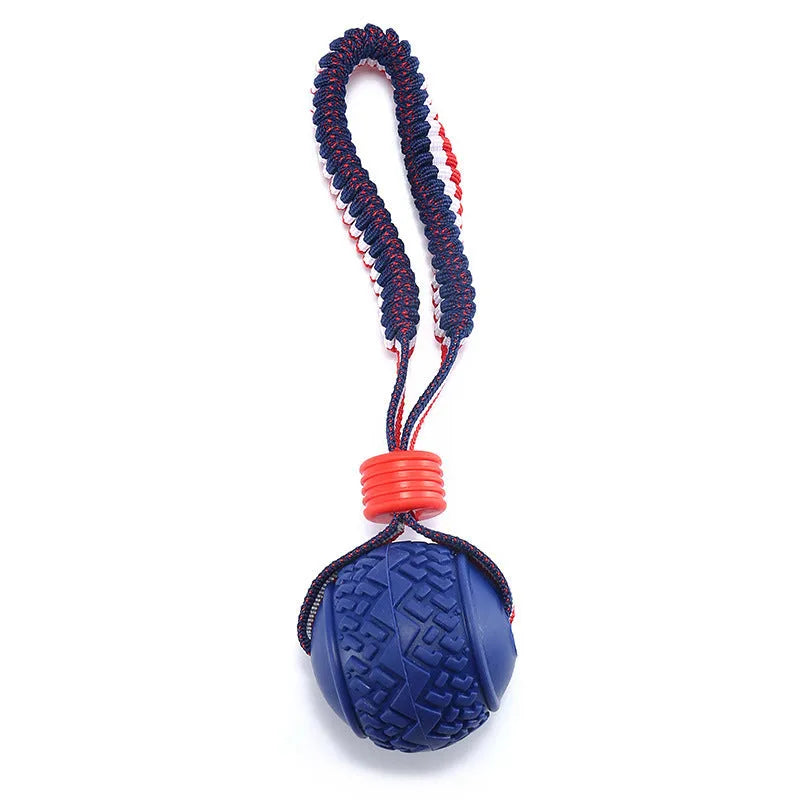 Blue dog toy showing a textured rubber ball attached to a woven rope, for small and medium breed dogs.