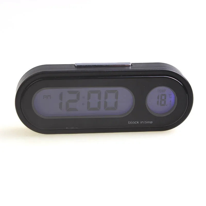 Black digital car dashboard clock and thermometer with LED display on an adjustable mounting bracket.