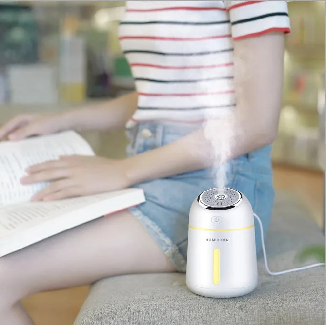 Mini ultrasonic USB humidifier 330ml in blue on desk with fan and LED light