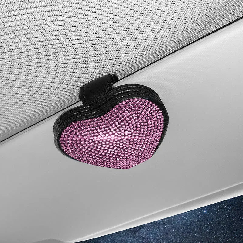 Black PU leather car sun visor clip with diamond accents holding sunglasses and a ticket.