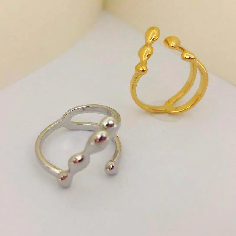 Brass opening ring with spherical elements in gold or silver finish, adjustable women's fashion jewellery